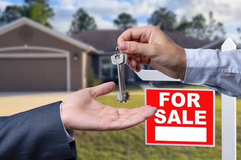 Real estate agent handing over house keys